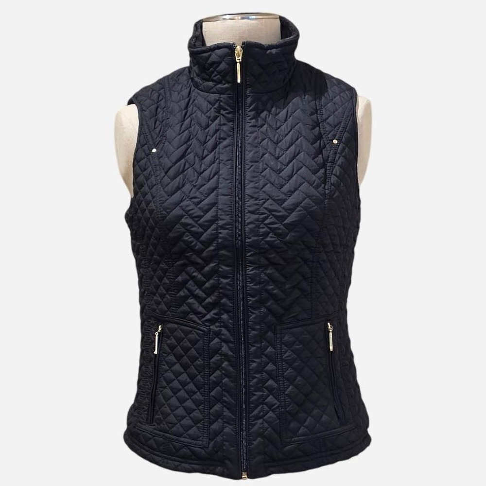 Weatherproof women's black quilted vest with a soft plush fleece lining